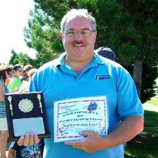 Our superintendent accepts his award